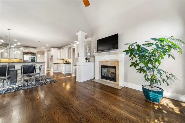 a bathroom with a double vanity sink a toilet and shower