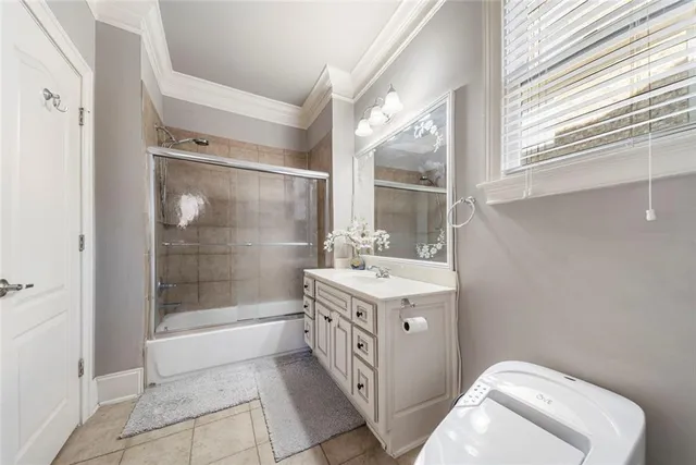 a white toilet sitting next to a bathroom sink