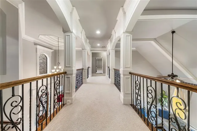 a living room with furniture and a ceiling fan