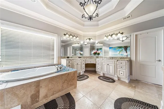 a bathroom with a tub shower and a sink