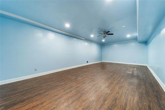 a view of a balcony with wooden floor and fence