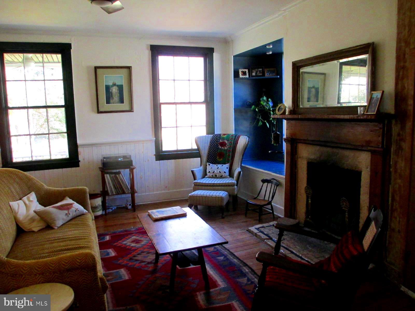 8355 Broad Neck Road Chestertown, MD 21620 - Photo 13 of 33 a living room with furniture a window and a fireplace