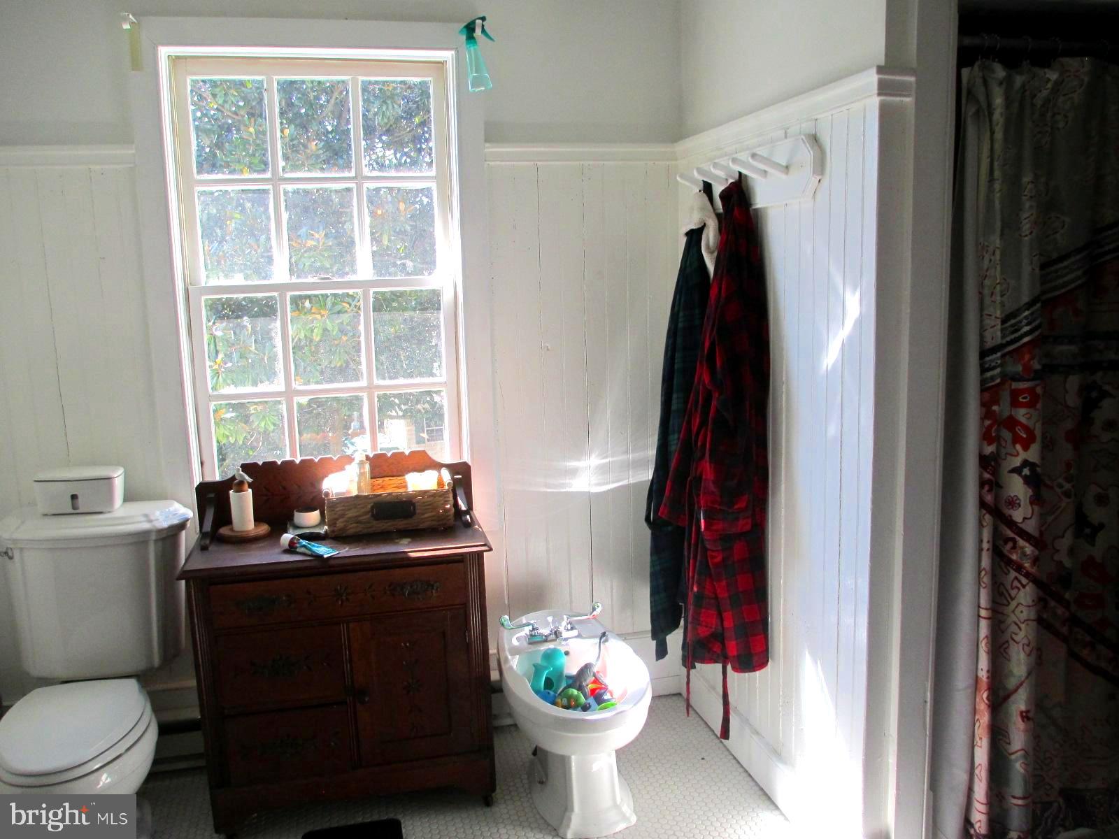 8355 Broad Neck Road Chestertown, MD 21620 - Photo 25 of 33 a bathroom with a toilet sink and mirror