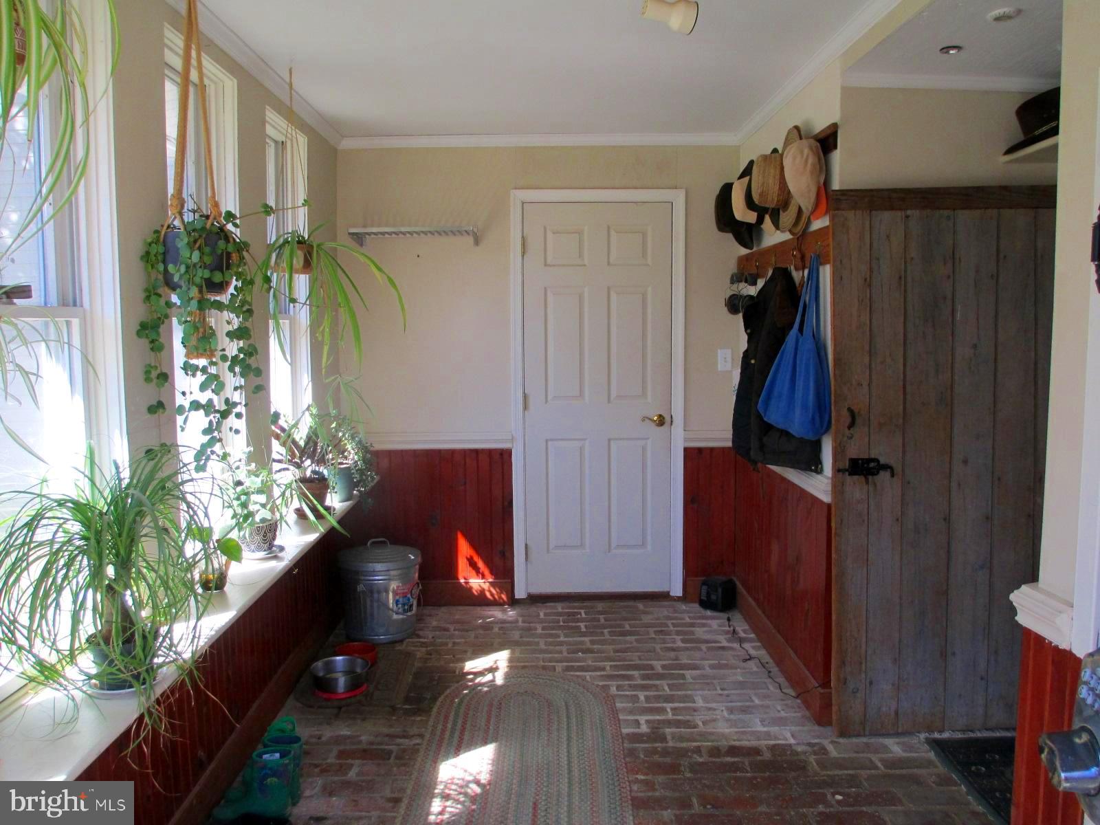 8355 Broad Neck Road Chestertown, MD 21620 - Photo 7 of 33 a view of entryway with a flower pot and a wooden floor
