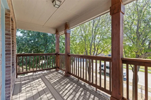 a view of balcony with wooden floor