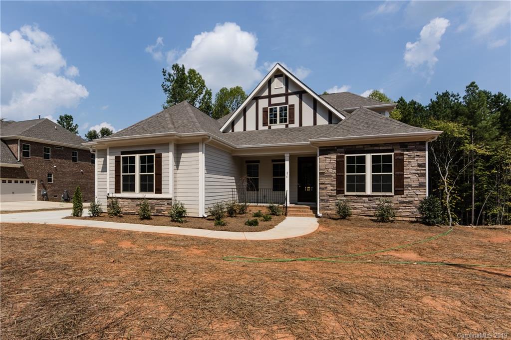 704 Kenway Loop Mooresville, NC 28117 - Photo 2 of 24 a front view of a house with sitting area and garden