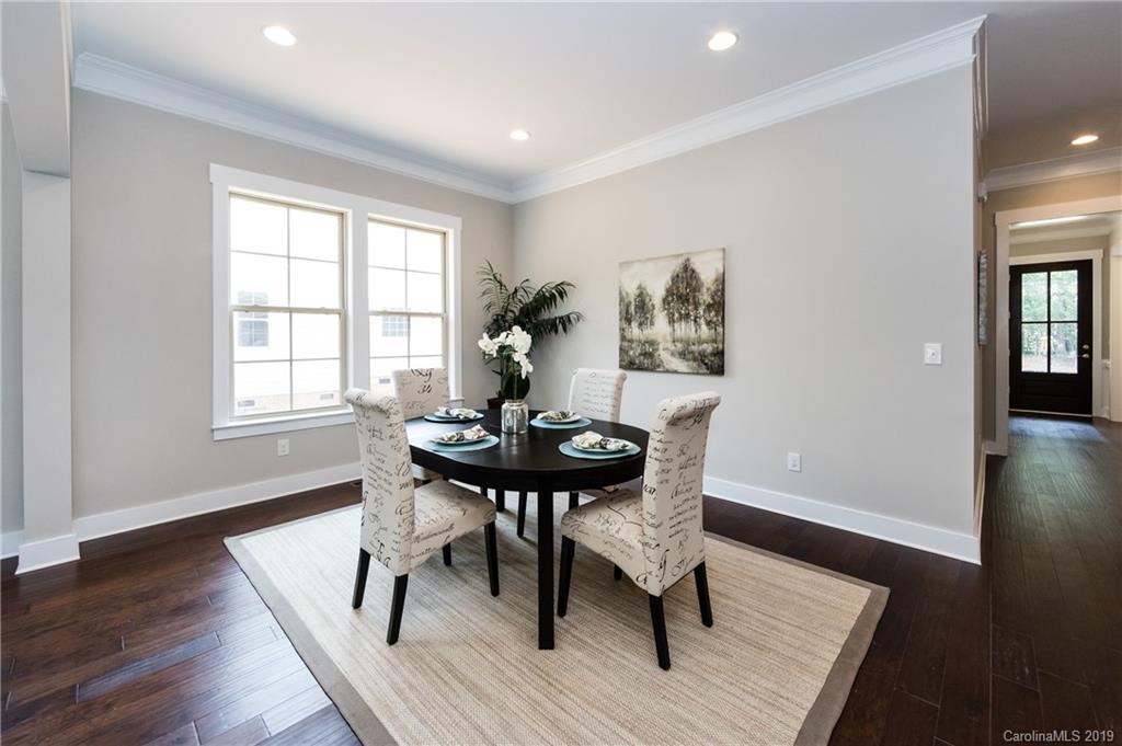 704 Kenway Loop Mooresville, NC 28117 - Photo 19 of 24 a view of a dining room with furniture and wooden floor