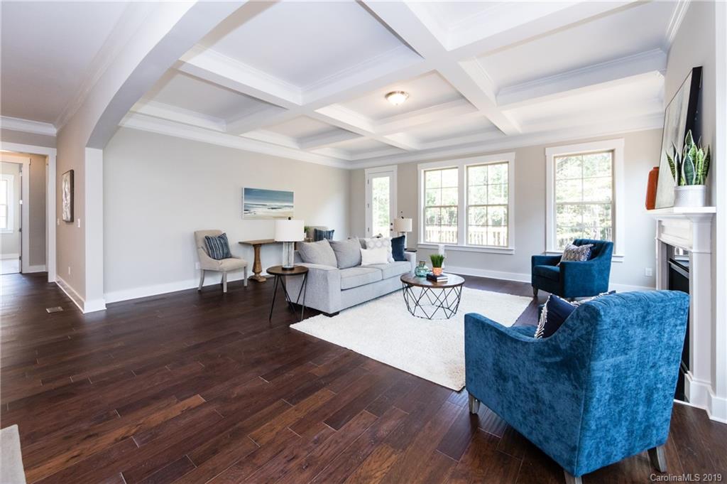 704 Kenway Loop Mooresville, NC 28117 - Photo 21 of 24 a living room with fireplace furniture and a wooden floor