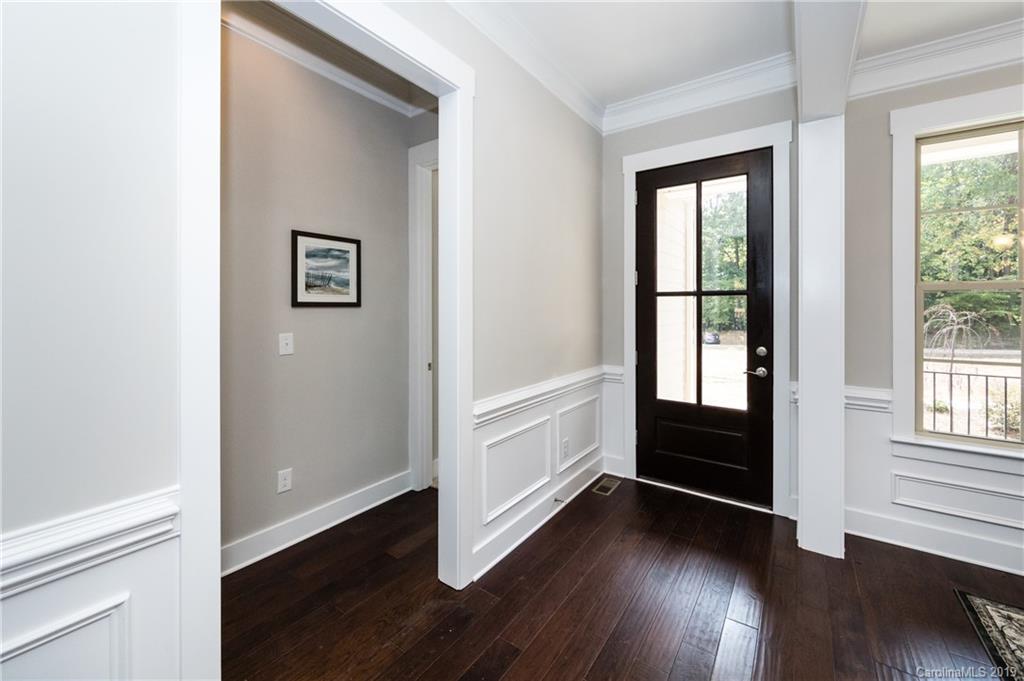 704 Kenway Loop Mooresville, NC 28117 - Photo 4 of 24 an empty room with wooden floor and windows
