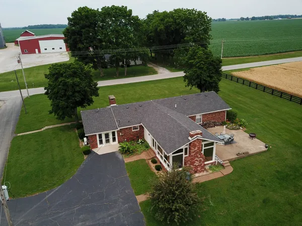 an aerial view of a house with a garden