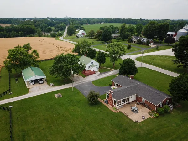 an aerial view of a house with a garden