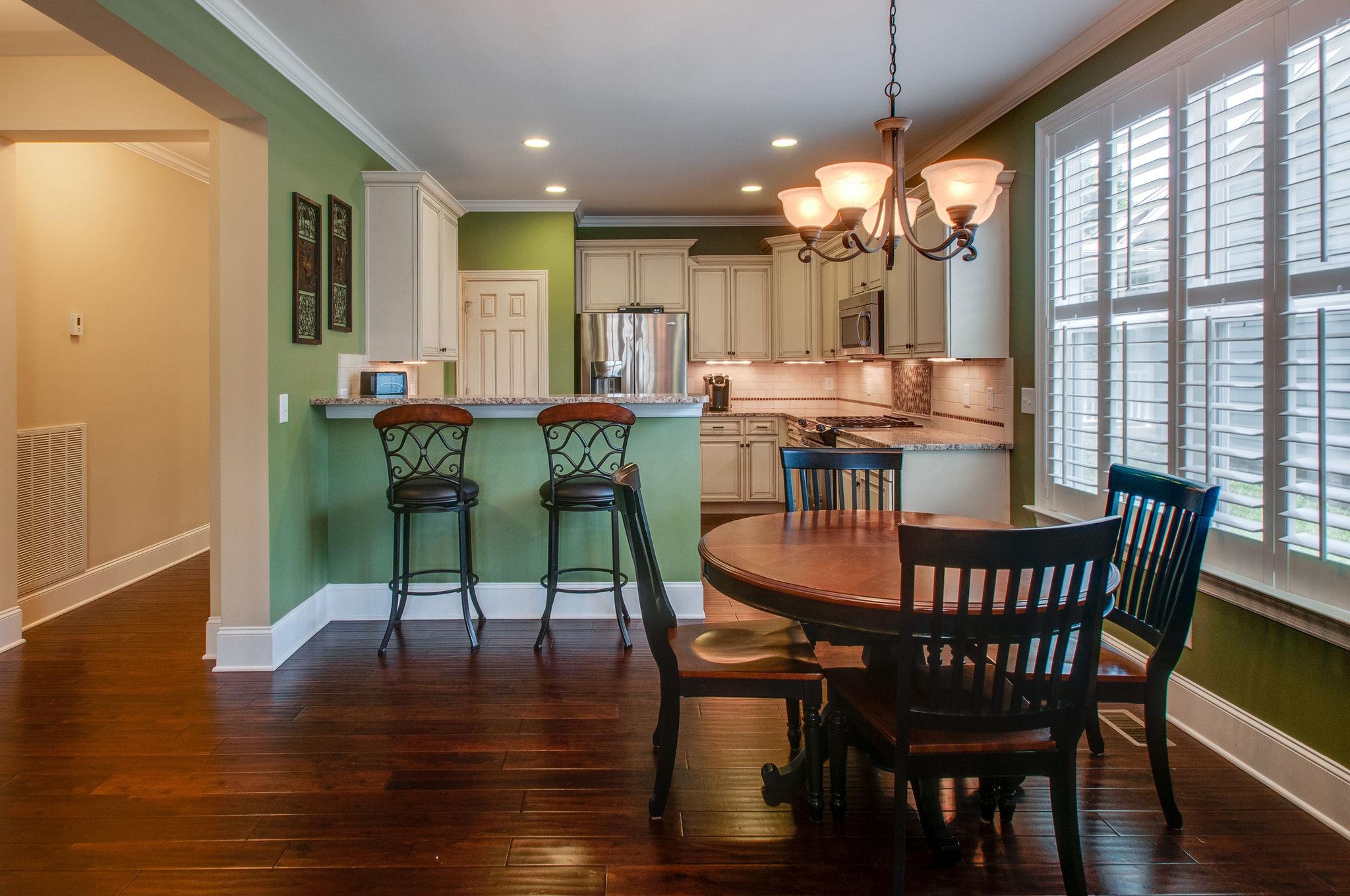 511 Phillips Drive Franklin, TN 37067 - Photo 12 of 29 a view of a dining room with furniture window and wooden floor