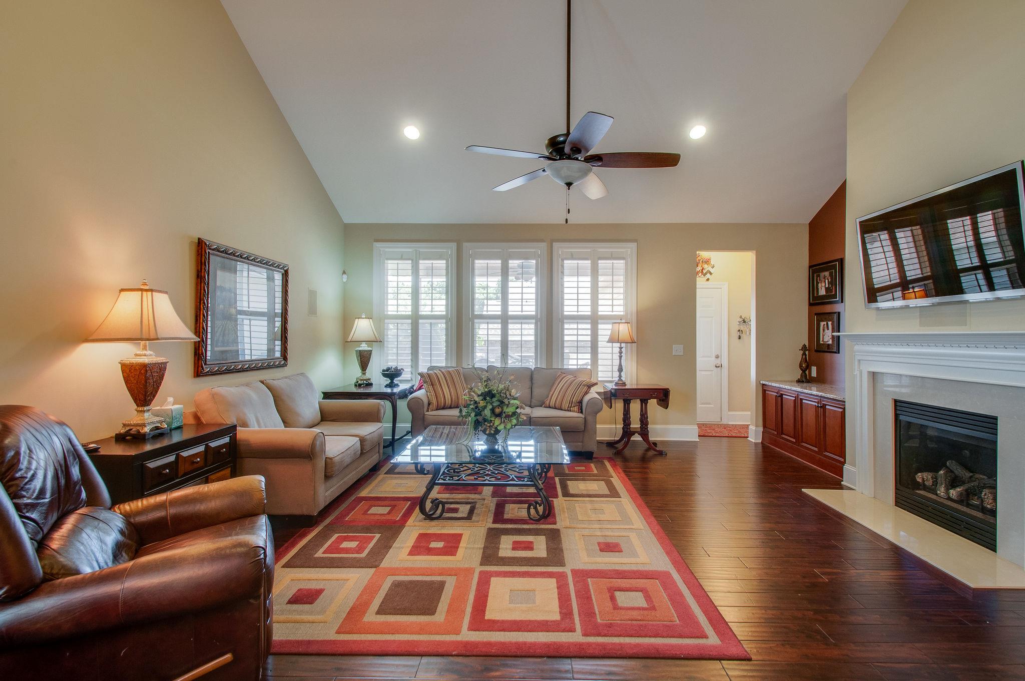 511 Phillips Drive Franklin, TN 37067 - Photo 13 of 29 a bed room with furniture and a fireplace
