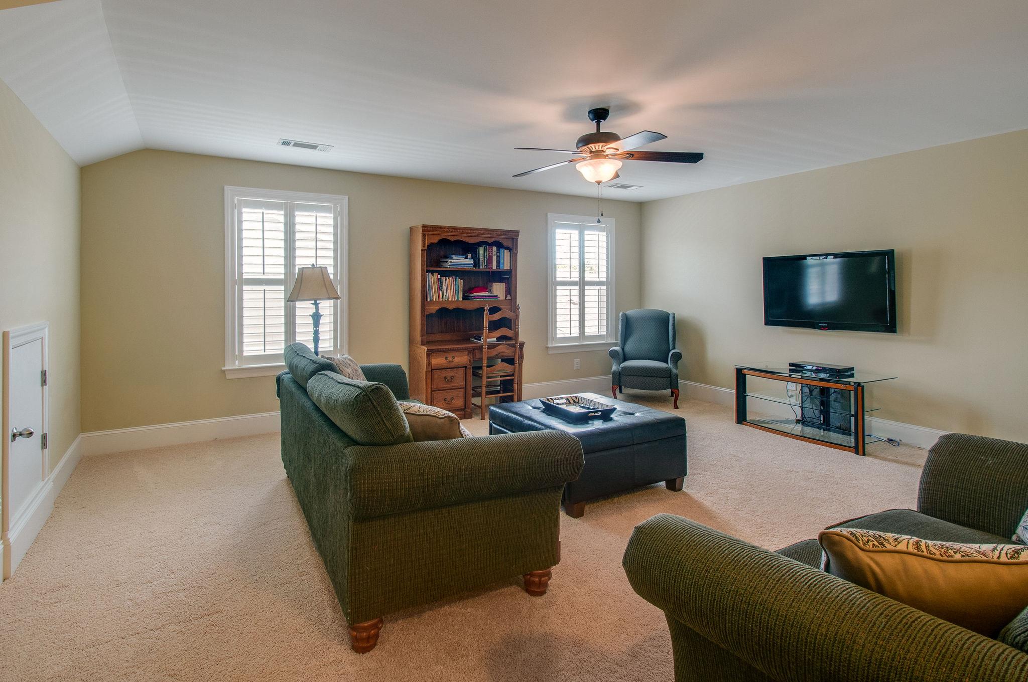511 Phillips Drive Franklin, TN 37067 - Photo 23 of 29 a living room with furniture and a flat screen tv