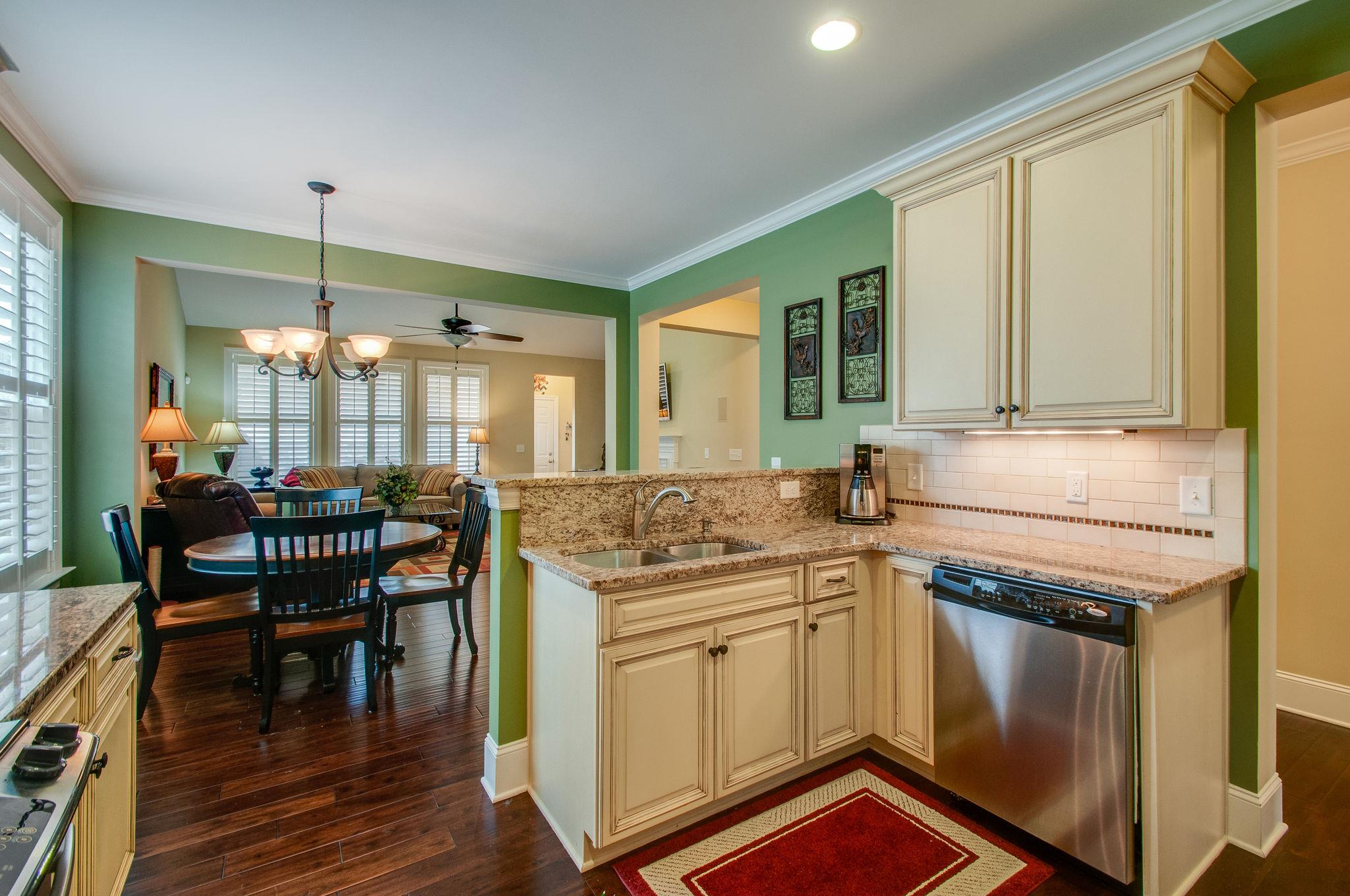 511 Phillips Drive Franklin, TN 37067 - Photo 10 of 29 a kitchen with stainless steel appliances granite countertop a stove a sink and a refrigerator