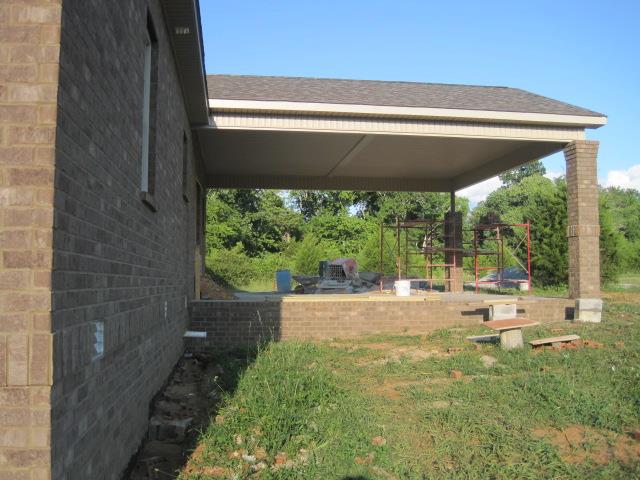1632 Goshen Road Lebanon, TN 37087 - Photo 3 of 14 Protect your vehicles or enjoy the views from your huge covered carport, placed right outside of your kitchen to make hosting a party or a family dinner outside easy.