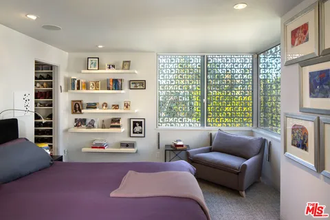 a bathroom with a tub sink and a potted plant
