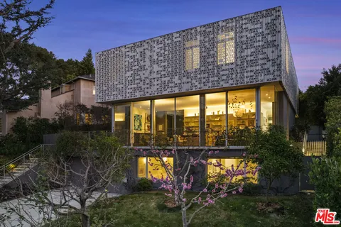 a view of a swimming pool with chairs in patio