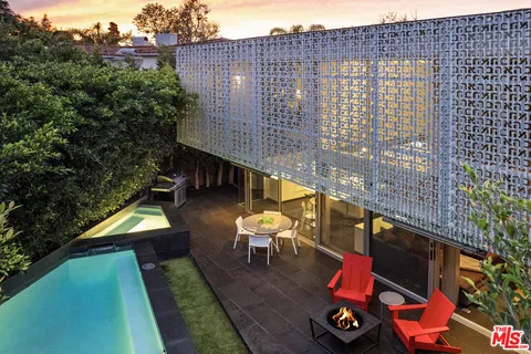 an aerial view of a house with a garden
