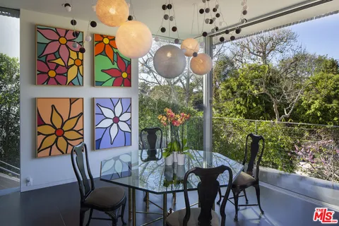 a kitchen with a table and chairs