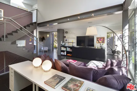 a room with gym equipment and a floor to ceiling window