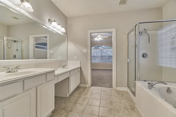 a bathroom with a bathtub and a shower