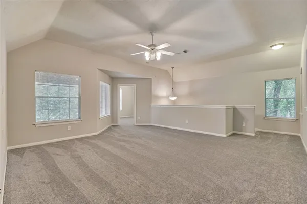 wooden floor in an empty room with a mirror
