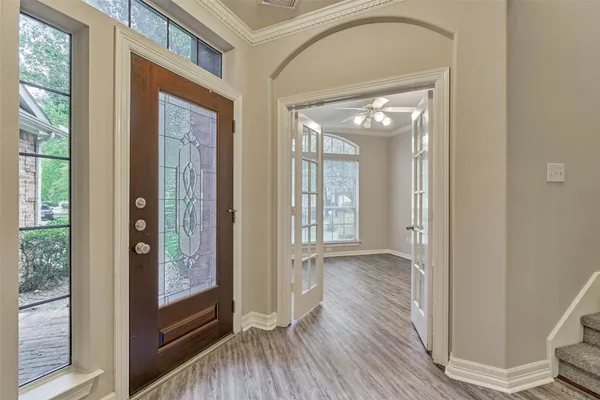 a view of gallery with wooden floor