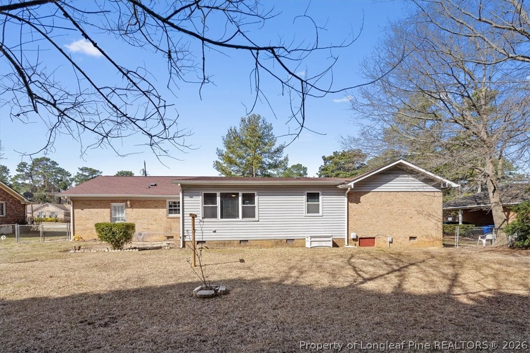 630 Bedford Road Fayetteville, NC 28303 - Photo 20 of 21 a view of a white house with a yard and wooden fence
