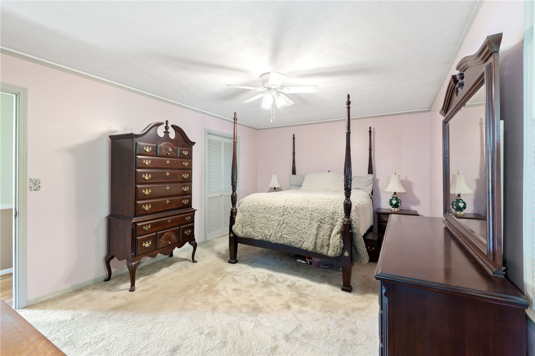 200 Echo Circle Easley, SC 29642 - Photo 15 of 35 Plush carpeting underfoot enhances this naturally illuminated bedroom with a high ceiling.