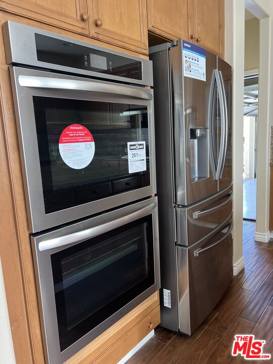 26526 Beecher Lane Stevenson Ranch, CA 91381 - Photo 13 of 31 a stove top oven sitting inside of a kitchen
