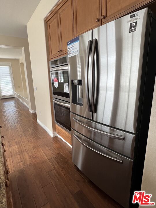 26526 Beecher Lane Stevenson Ranch, CA 91381 - Photo 14 of 31 a metallic refrigerator freezer sitting in a kitchen