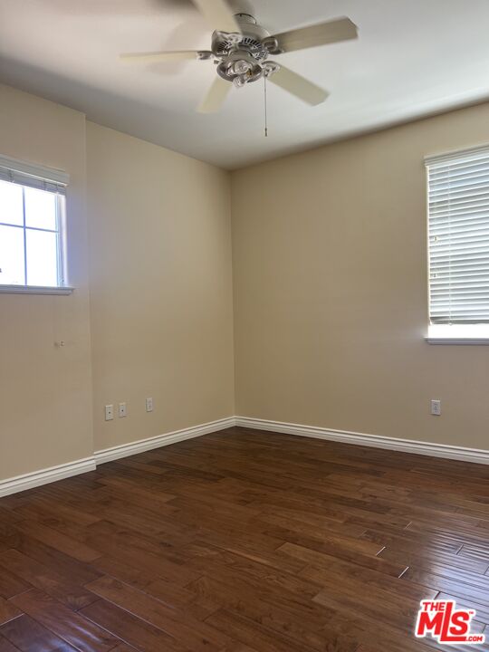 26526 Beecher Lane Stevenson Ranch, CA 91381 - Photo 15 of 31 a view of an empty room with wooden floor and a window