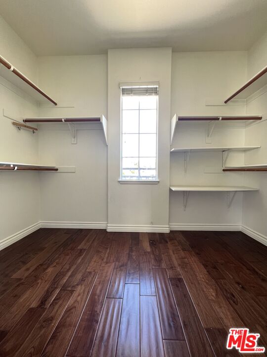 26526 Beecher Lane Stevenson Ranch, CA 91381 - Photo 18 of 31 a view of a room with wooden floors and closet