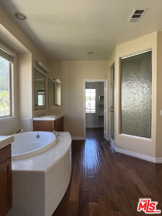26526 Beecher Lane Stevenson Ranch, CA 91381 - Photo 19 of 31 a bathroom with a sink and a mirror