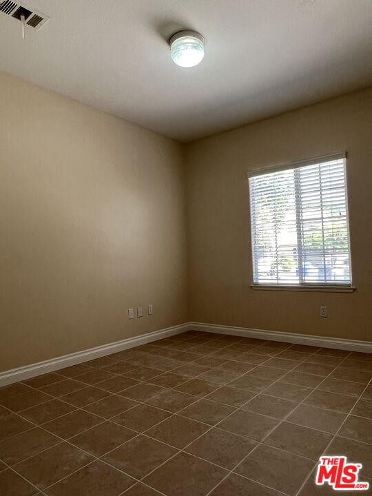 26526 Beecher Lane Stevenson Ranch, CA 91381 - Photo 22 of 31 an empty room with a empty space and windows