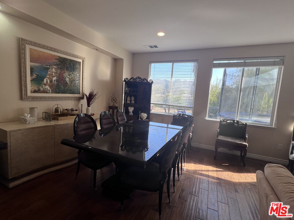 26526 Beecher Lane Stevenson Ranch, CA 91381 - Photo 3 of 31 a view of a dining room with furniture window and outside view