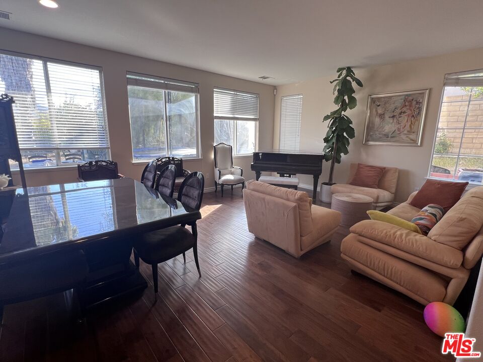 26526 Beecher Lane Stevenson Ranch, CA 91381 - Photo 4 of 31 a living room with furniture and a large window