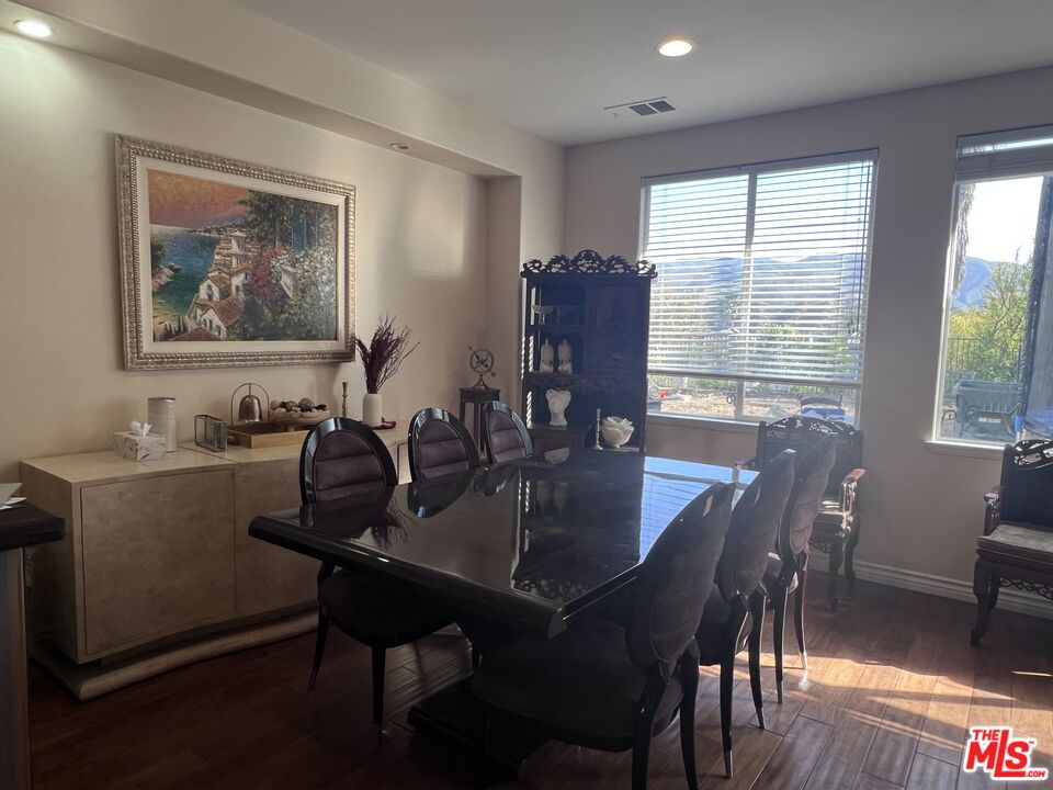26526 Beecher Lane Stevenson Ranch, CA 91381 - Photo 5 of 31 a view of a dining room with furniture window and wooden floor