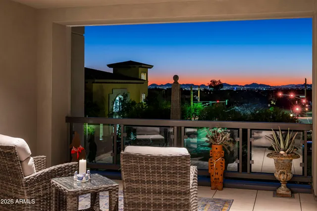 a bedroom with a large bed and a couch