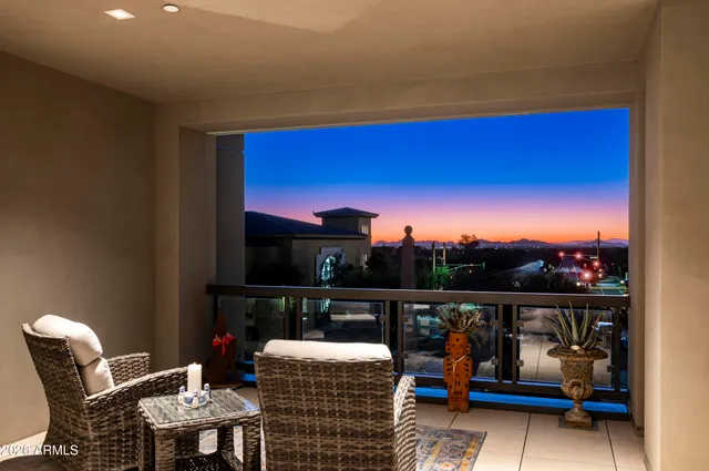 a view of a chairs and table in the roof