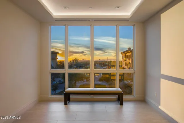 a view of a house with swimming pool and sitting area