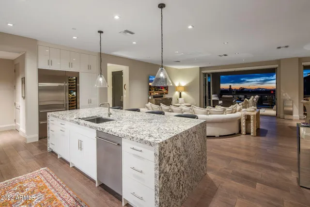 a kitchen with a sink stove and cabinets