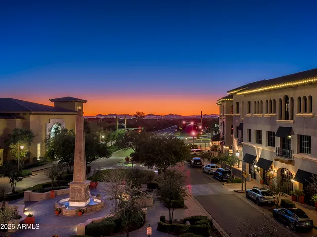 a view of a lush green hillside and a houses