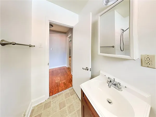 a bathroom with a bath tub with a shower