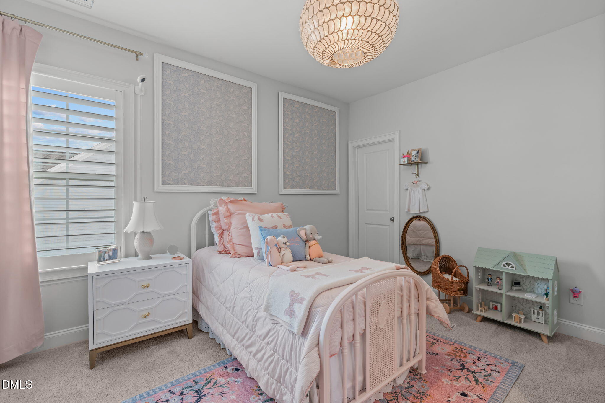 4144 Olde Judd Drive Willow Spring, NC 27592 - Photo 28 of 52 a bedroom with a bed and a chandelier
