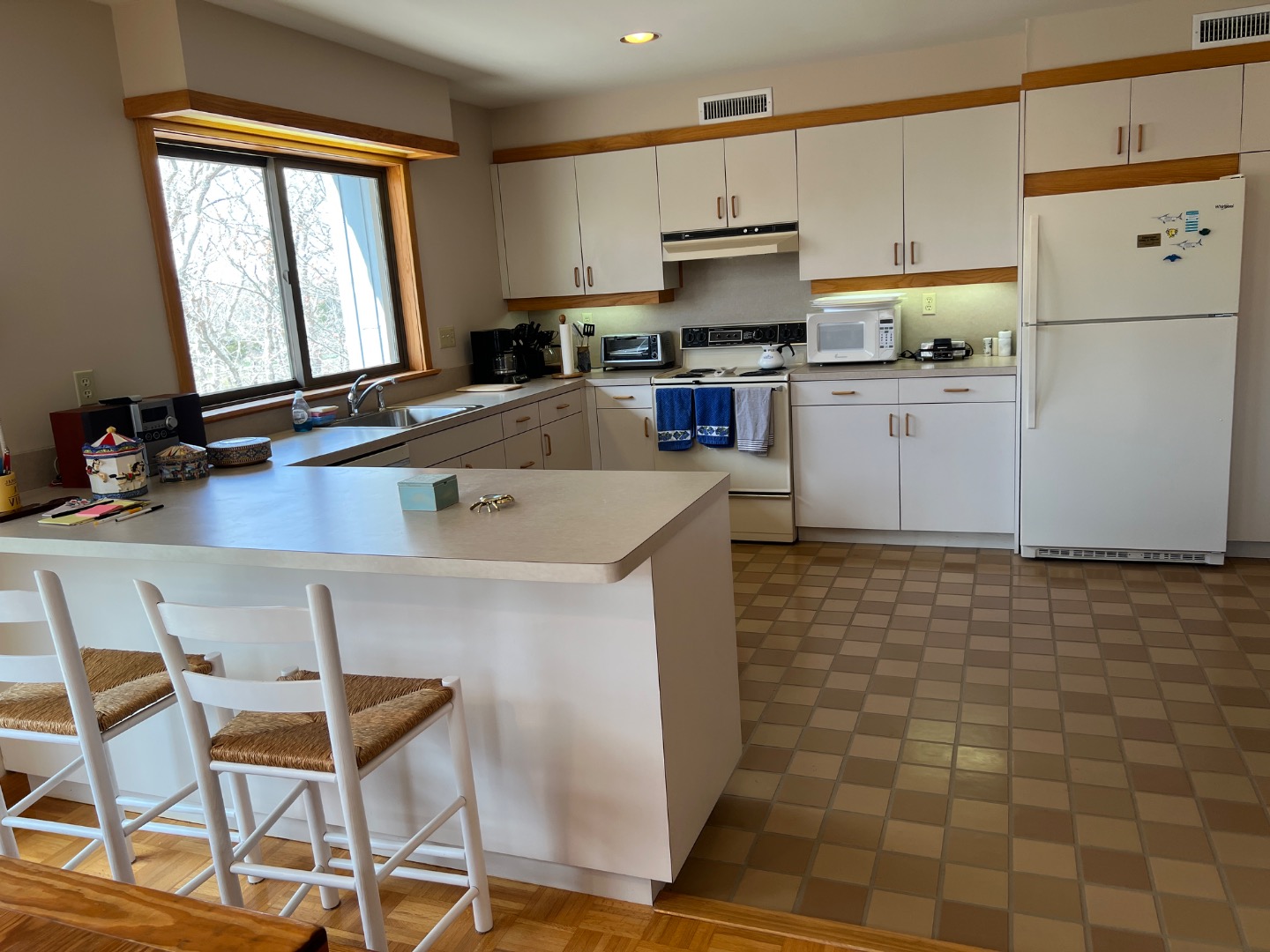 82 Oyster Pond Road Edgartown, MA 02539 - Photo 14 of 53 a kitchen with a sink cabinets and window