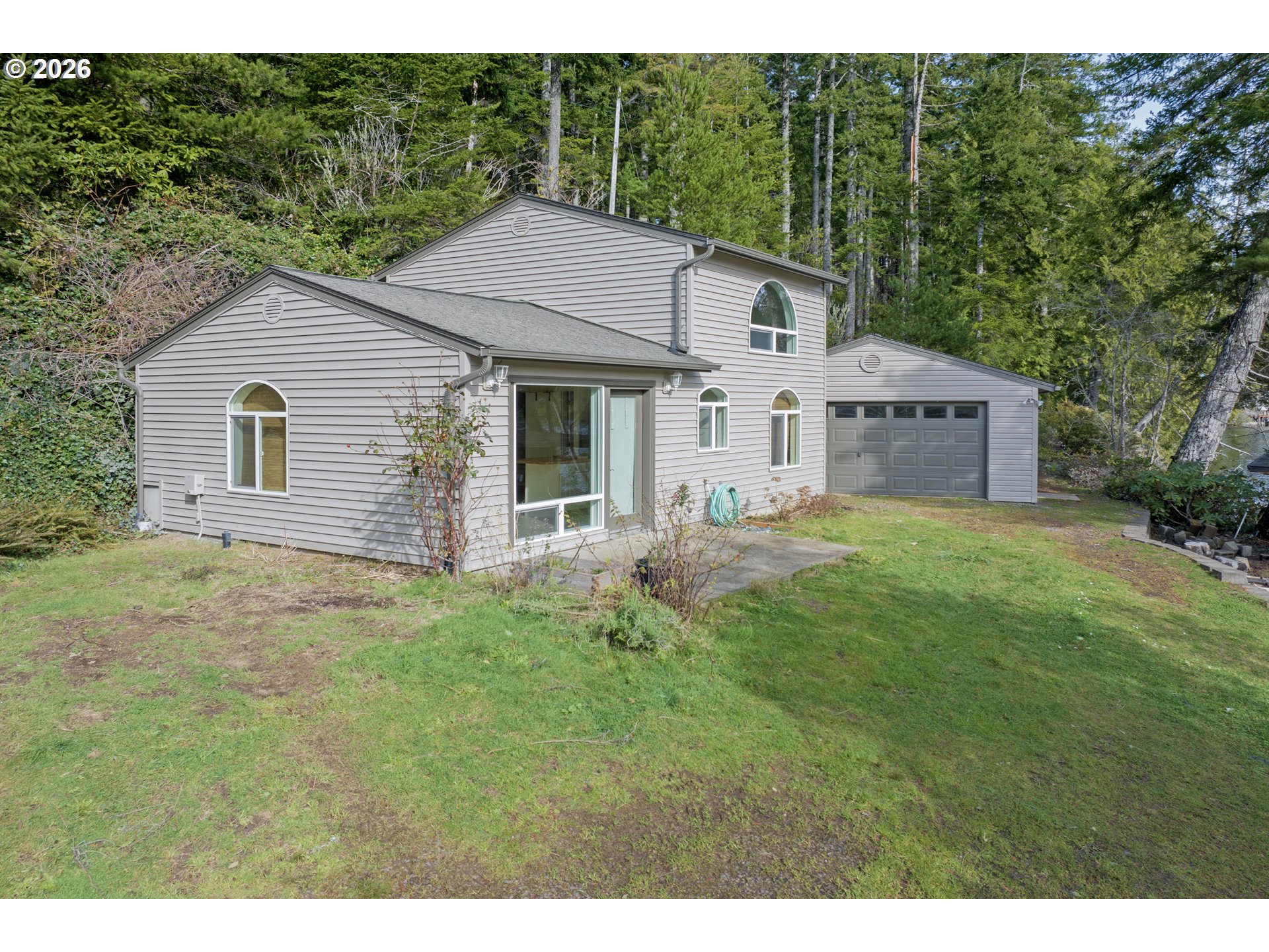 5816 Martin Road Florence, OR 97439 - Photo 42 of 47 a house view with a garden space