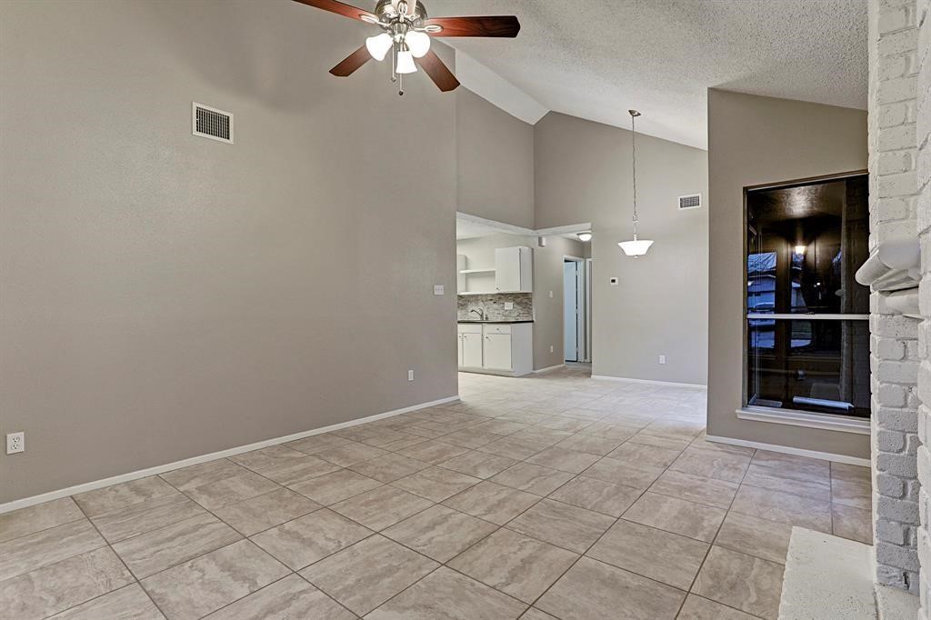 23322 Pebworth Place Spring, TX 77373 - Photo 3 of 10 a view of empty room with wooden floor and fan