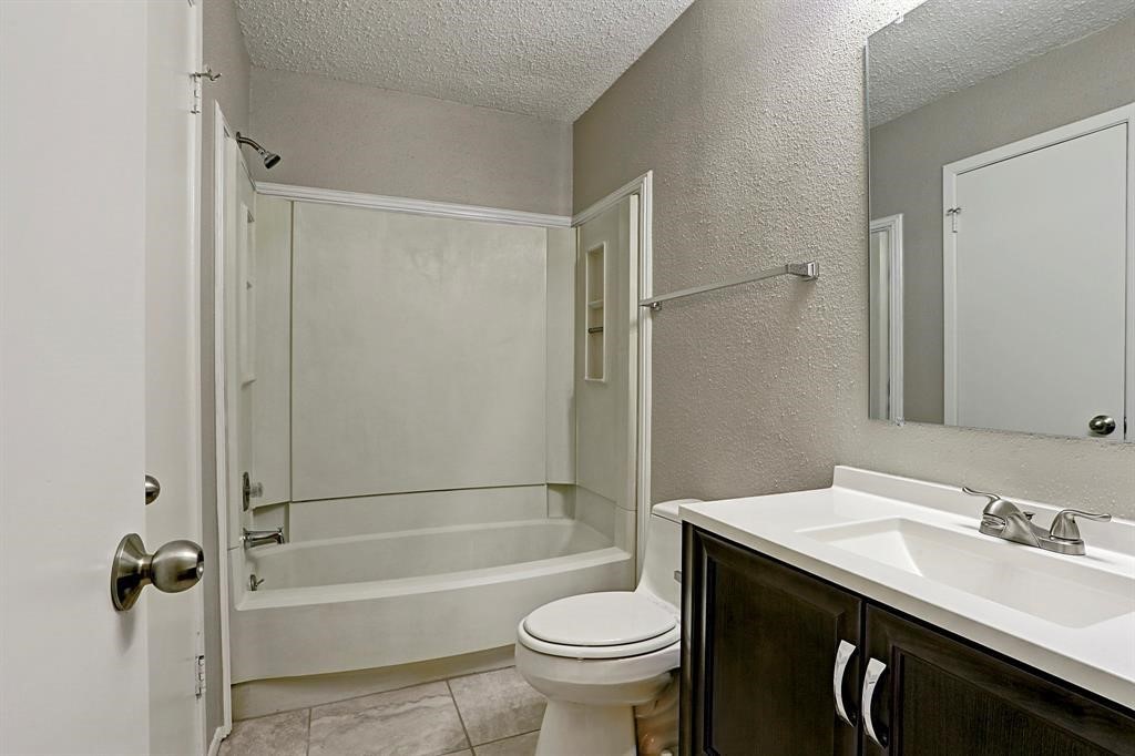 23322 Pebworth Place Spring, TX 77373 - Photo 8 of 10 a bathroom with a sink a toilet and shower